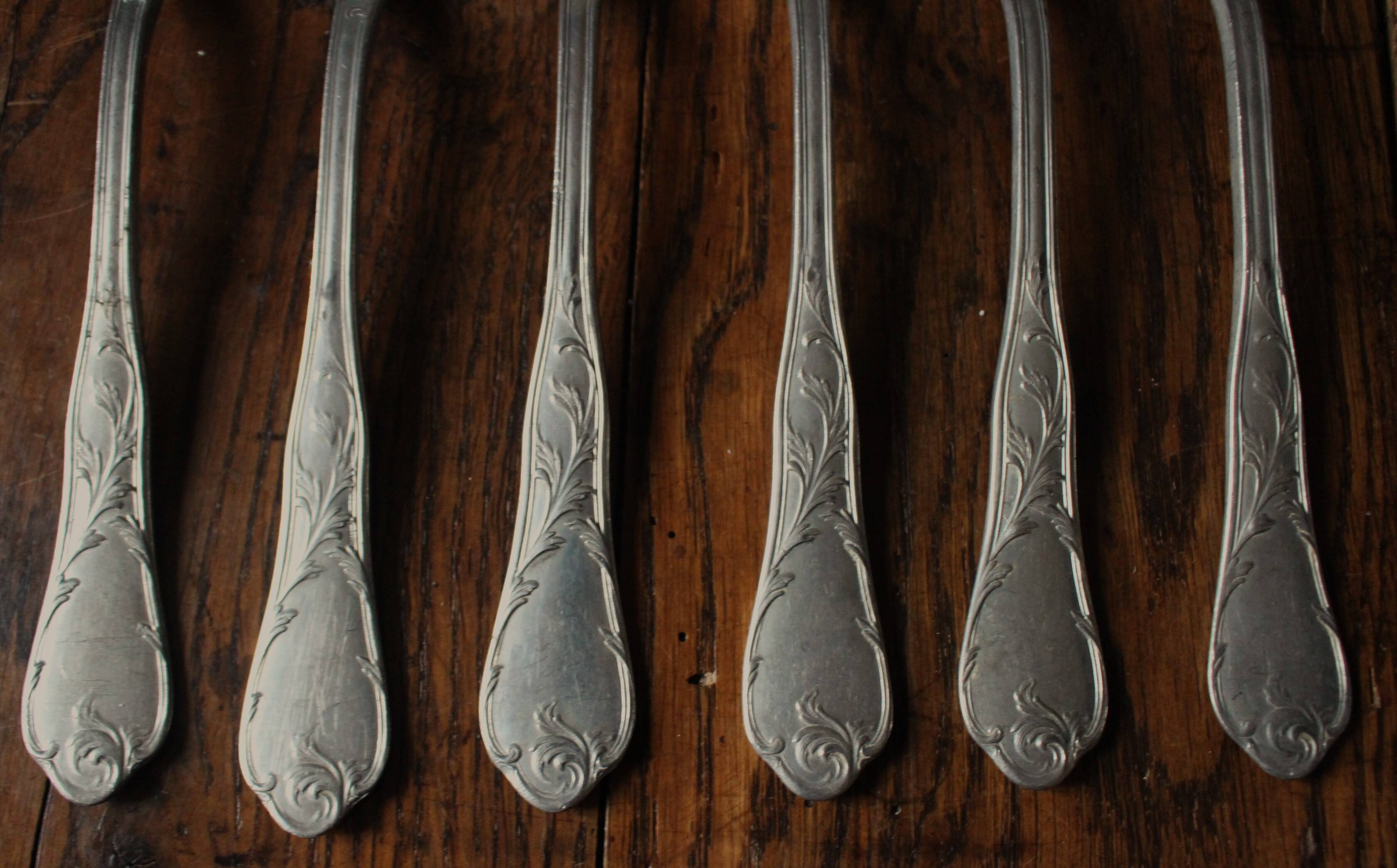 A set of 6 old flowered metal forks