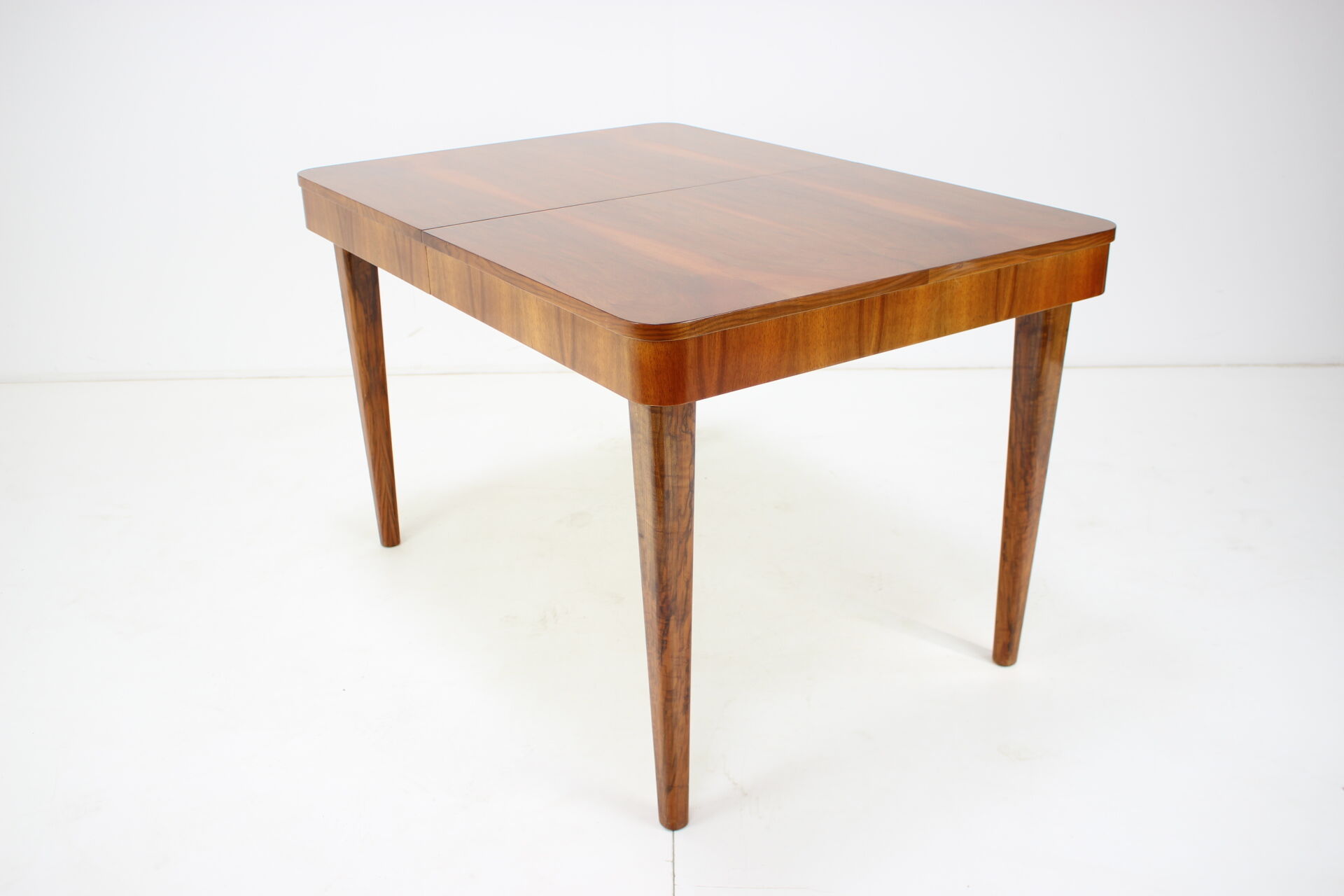 Extendable dining table designed by Jindřich Halabala for UP Závody, 1957.