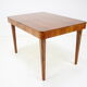 Extendable dining table designed by Jindřich Halabala for UP Závody, 1957.