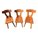 Three solid wood chairs