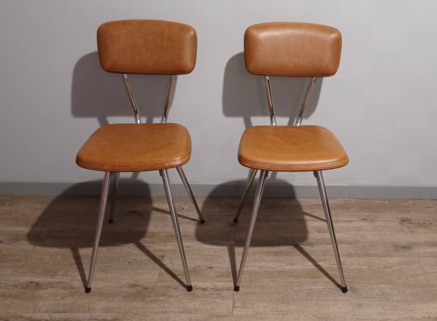 Pair of vintage faux leather and chrome chairs