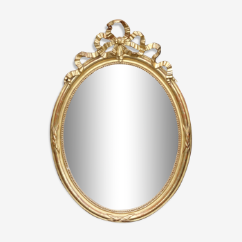 Miroir ovale Louis XVI doré à la feuille, époque XIXème, 110x76