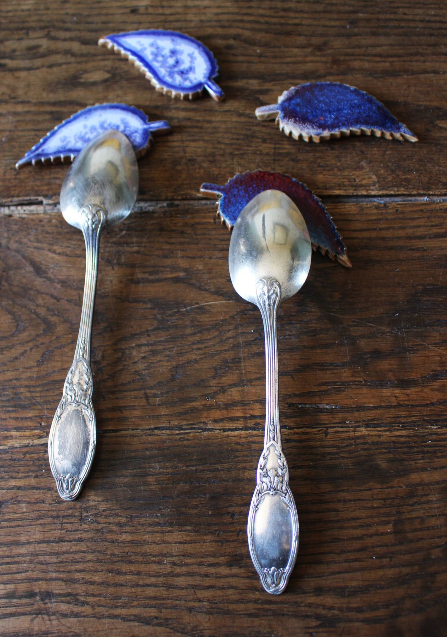 A set of 4 handcrafted pottery knife rests in blue.