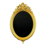 Miroir ovale doré style Louis XVI, XIXe siècle
