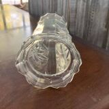 Transparent glass vase with relief floral decoration from the 1980s, fluted neck and polygonal base.