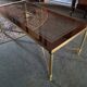 Coffee table in gilded brass and glass top