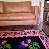 Oltenian floral rug handwoven in wool, purple flowers on black and pink background