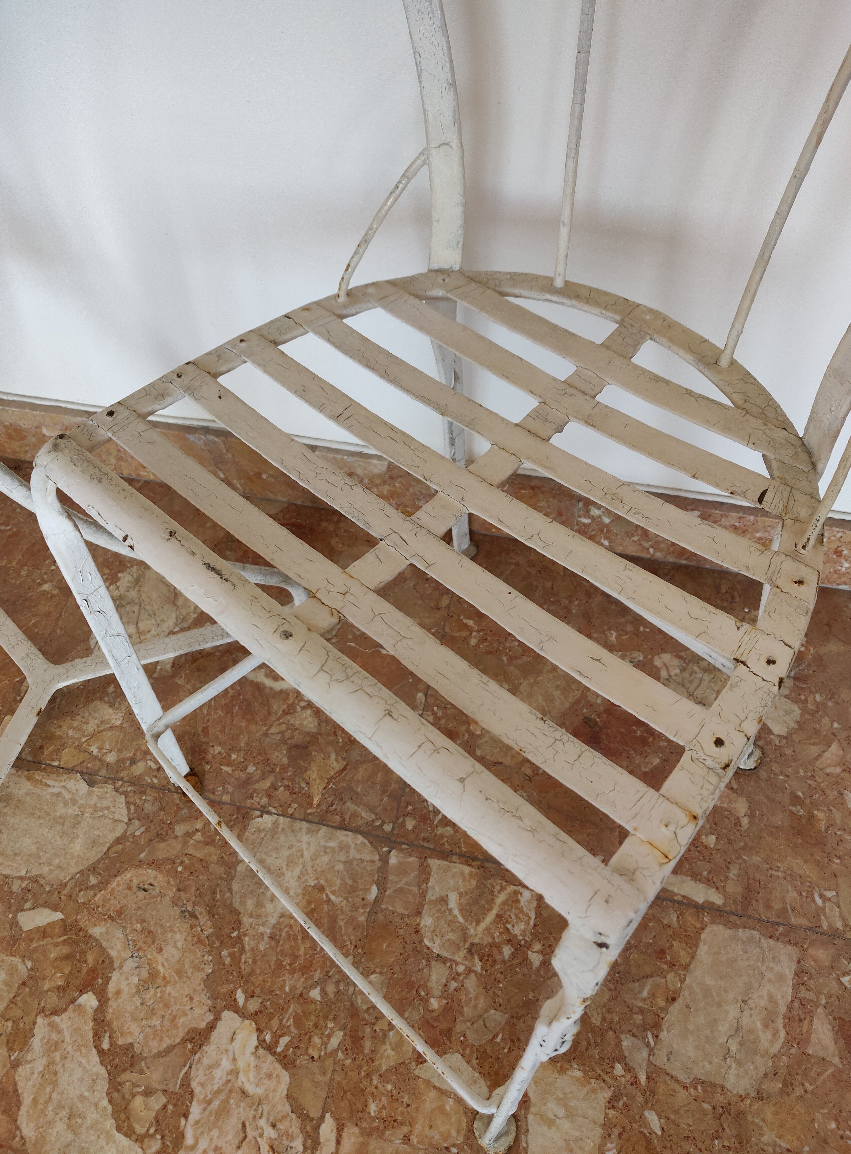 Table and bistro chairs wrought iron terrace