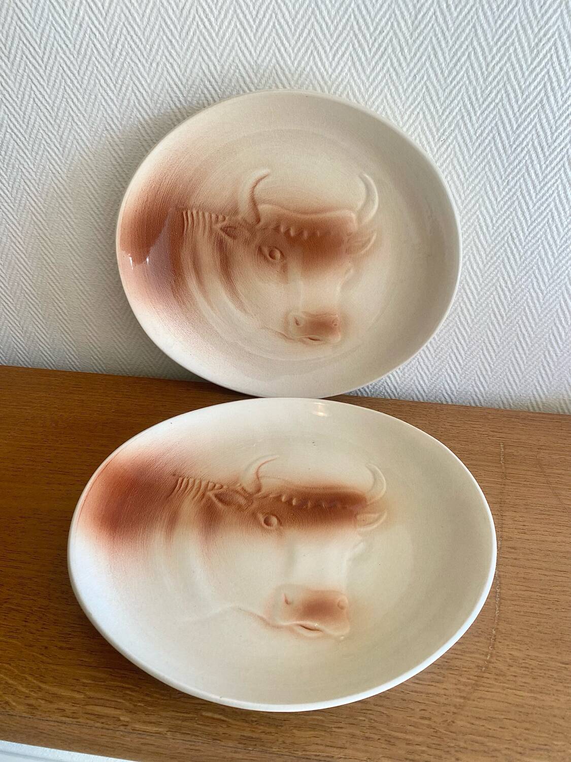 Saint Amand plates with cow head decoration.