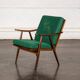Boomerang chair in green fabric