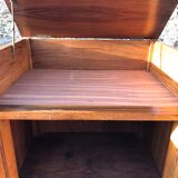 Art Deco sideboard bar cabinet in solid walnut with 3 doors and 1 richly carved tilting false drawer.