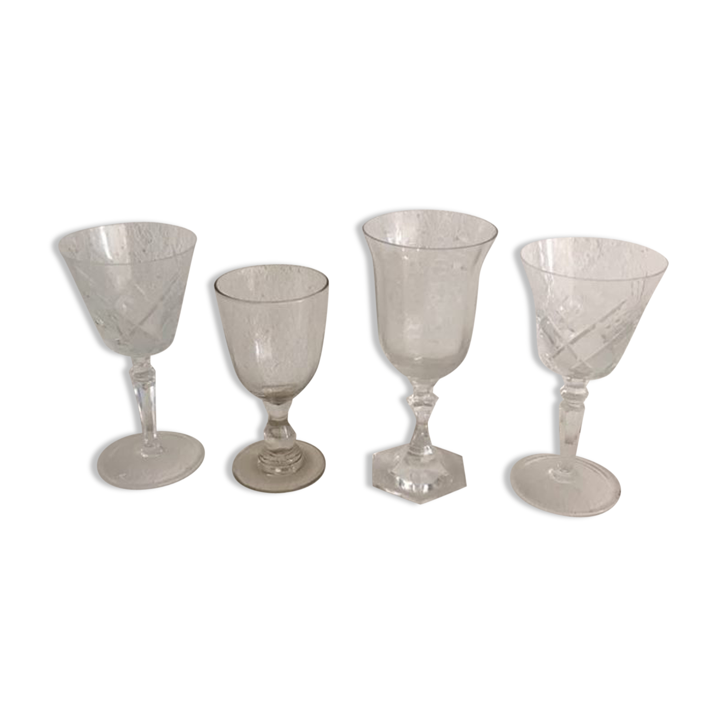 Four mismatched stemware