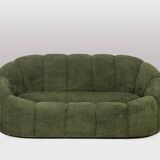 Sofa in bouclette fabric. Contemporary work.
