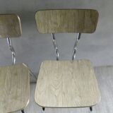 Pair of chairs in "wood" formica and gold edges, 1960s