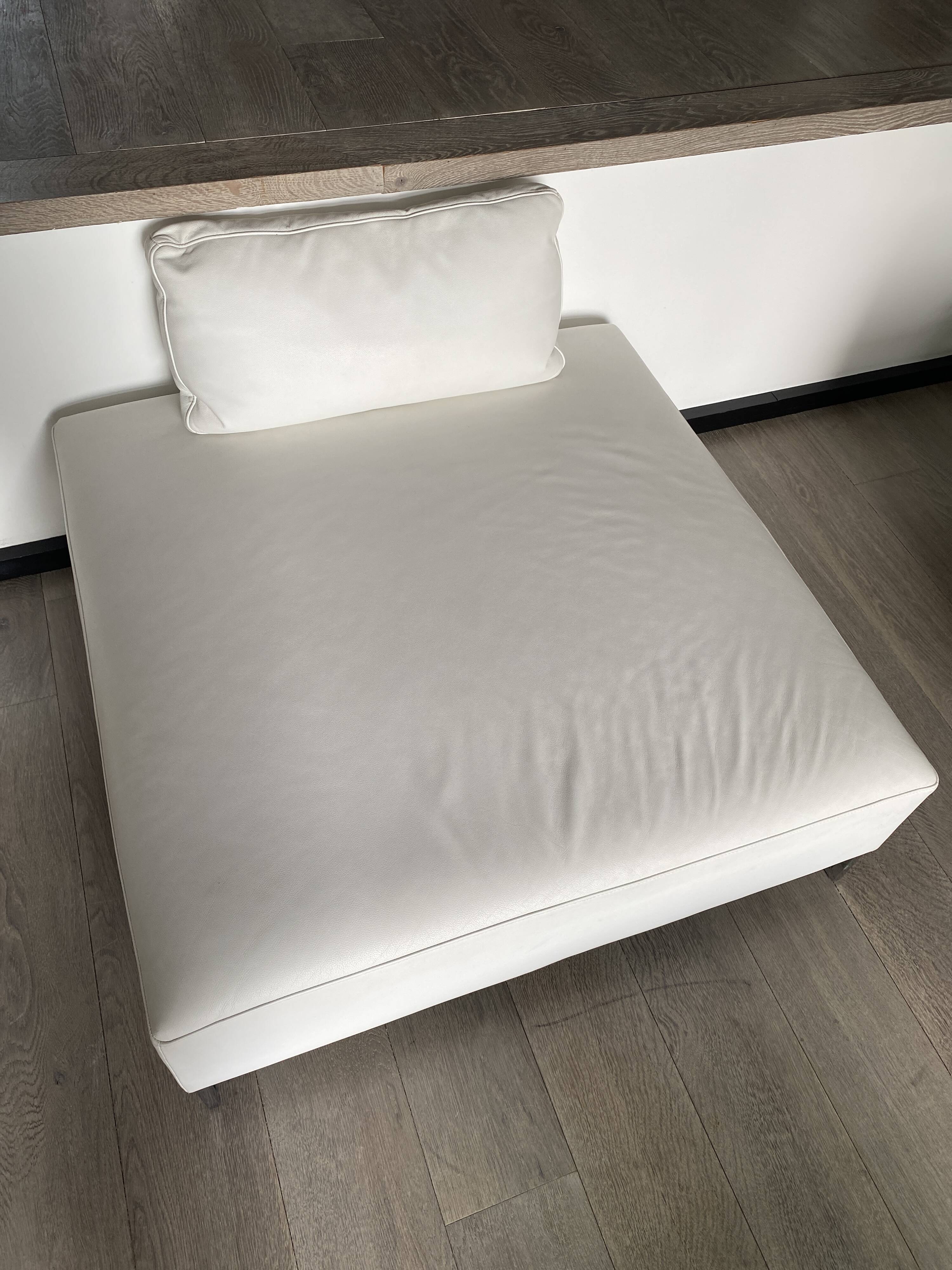 White leather pouf matching Ligne Roset sofa