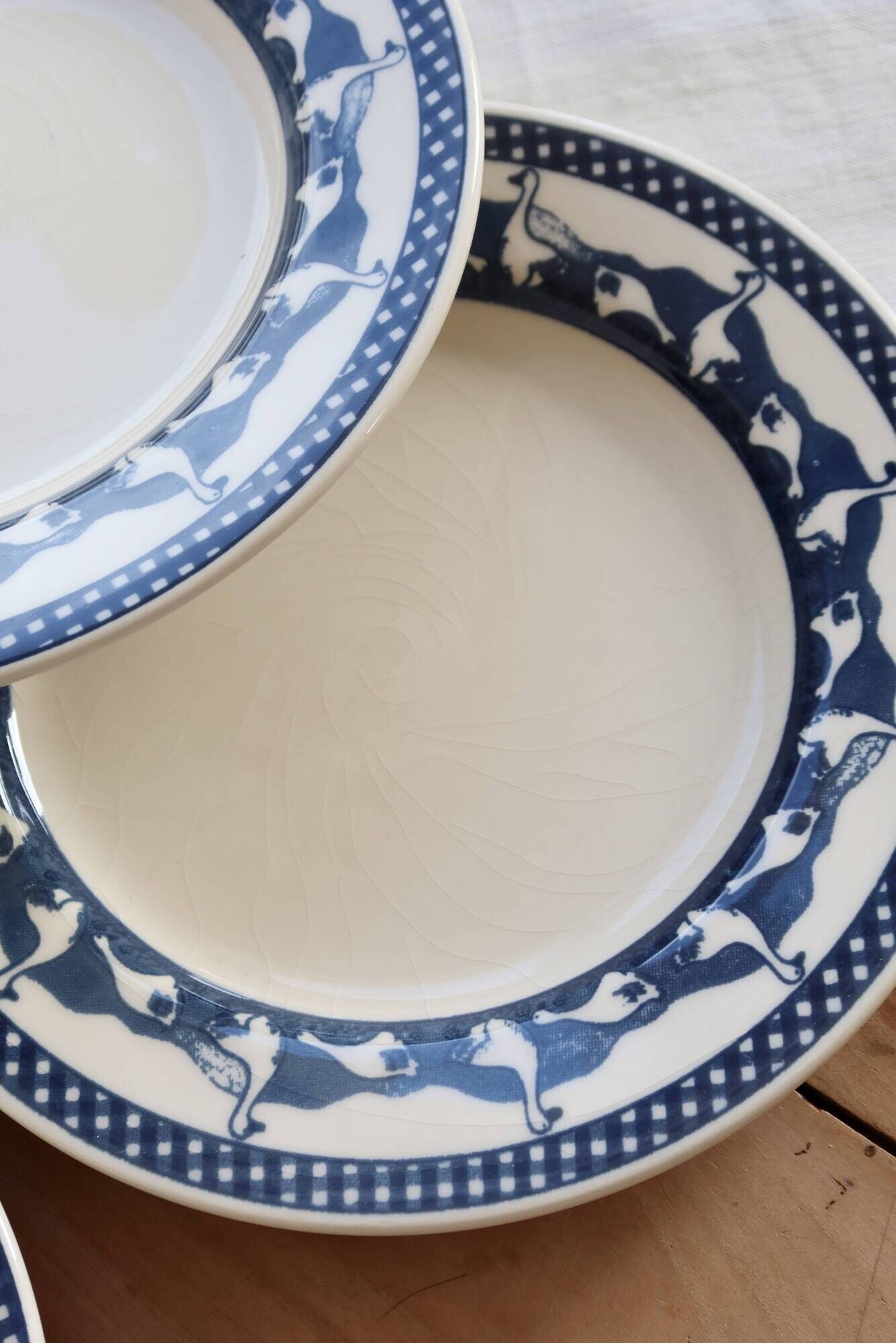 6 vintage flat plates with a blue and white goose pattern.