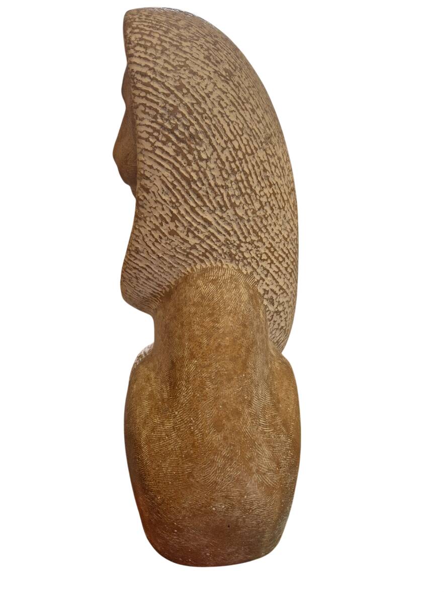 Sculpture of a lion in stone by Islay Grimes.