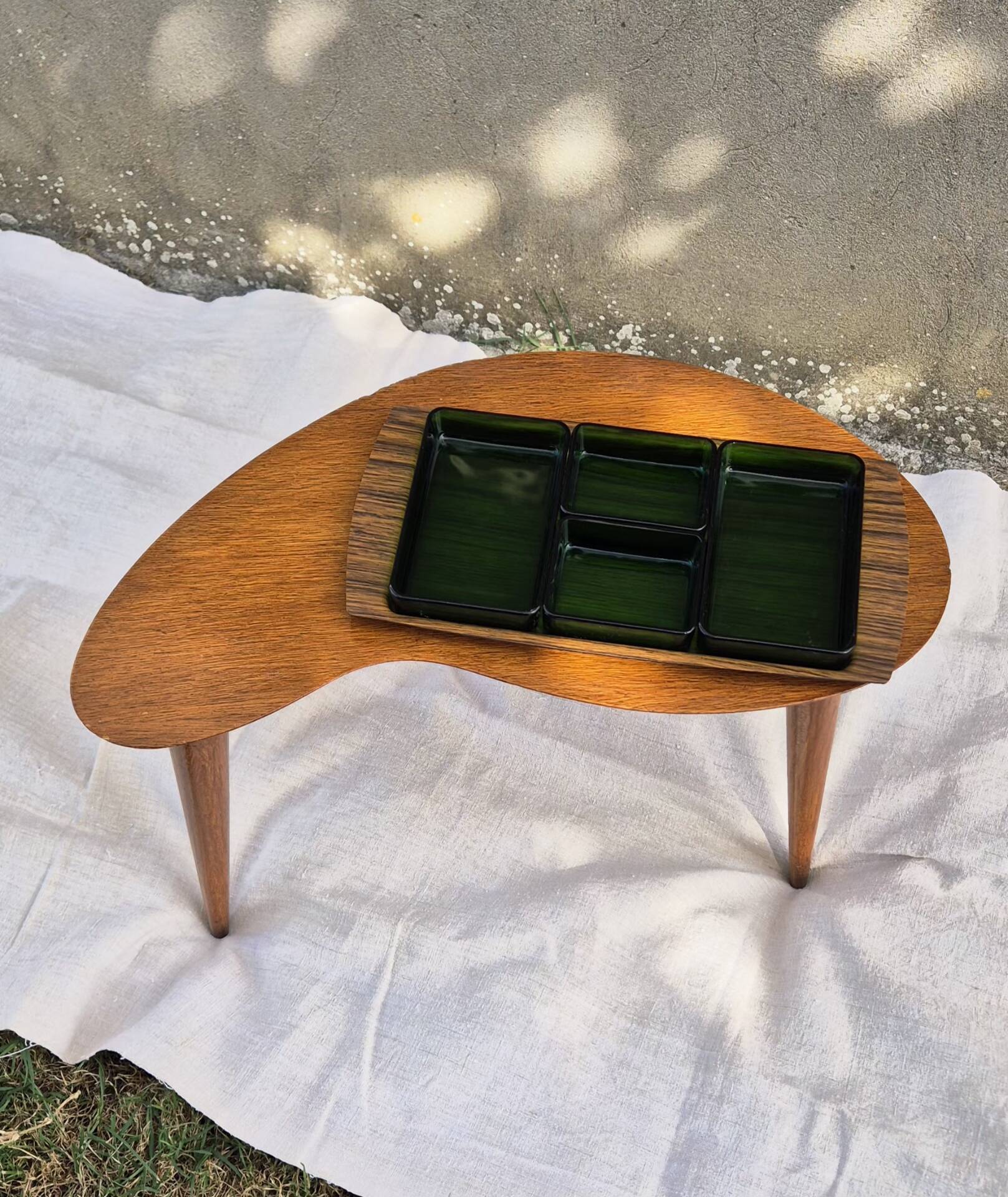 Vintage Scandinavian bean side table with wooden tapered legs.