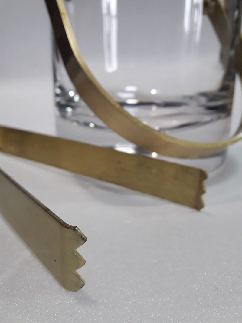Ice bucket, ice cubes and its vintage pliers