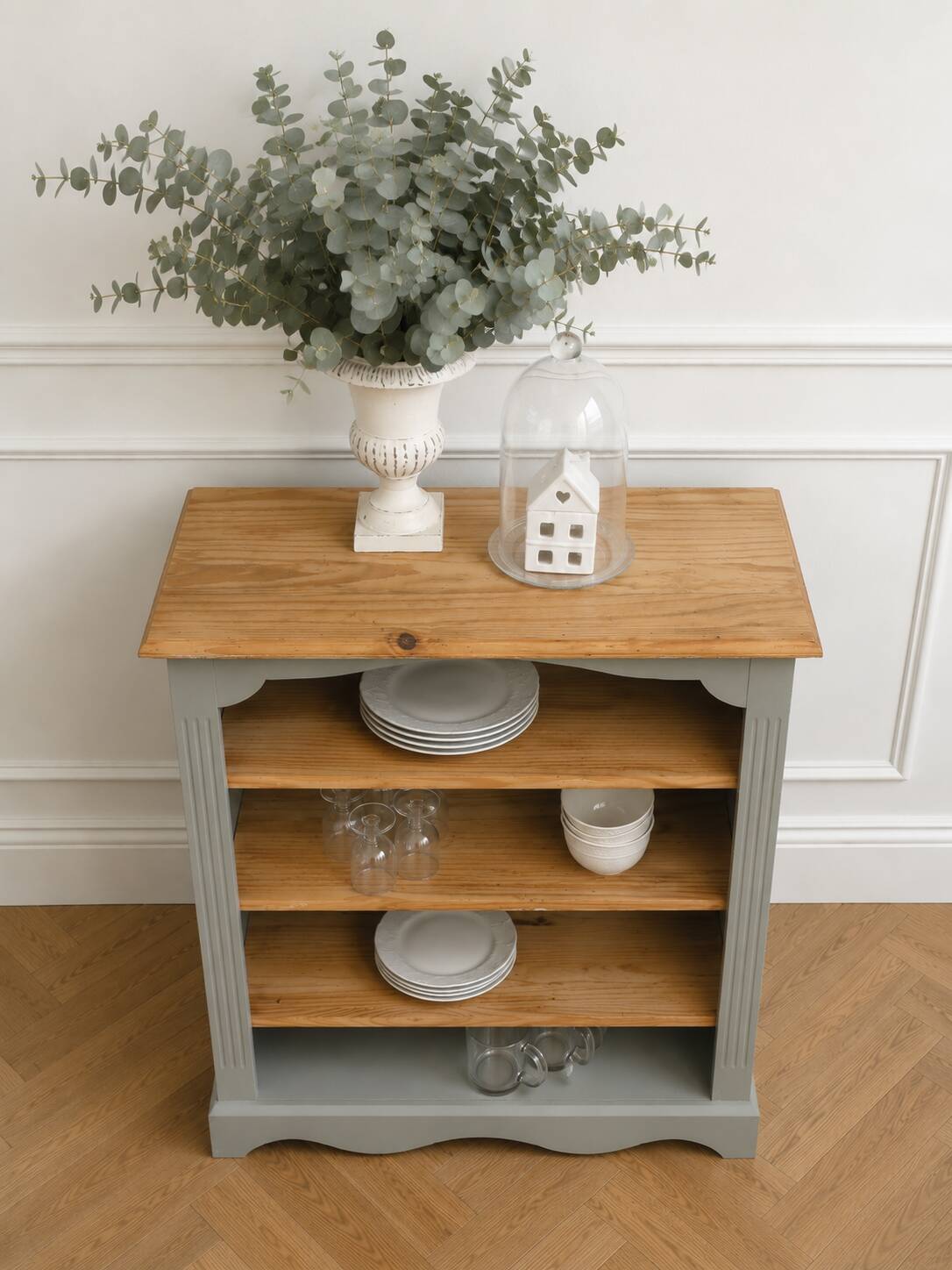 Green-grey library, wooden shelf and shelves in natural wood.