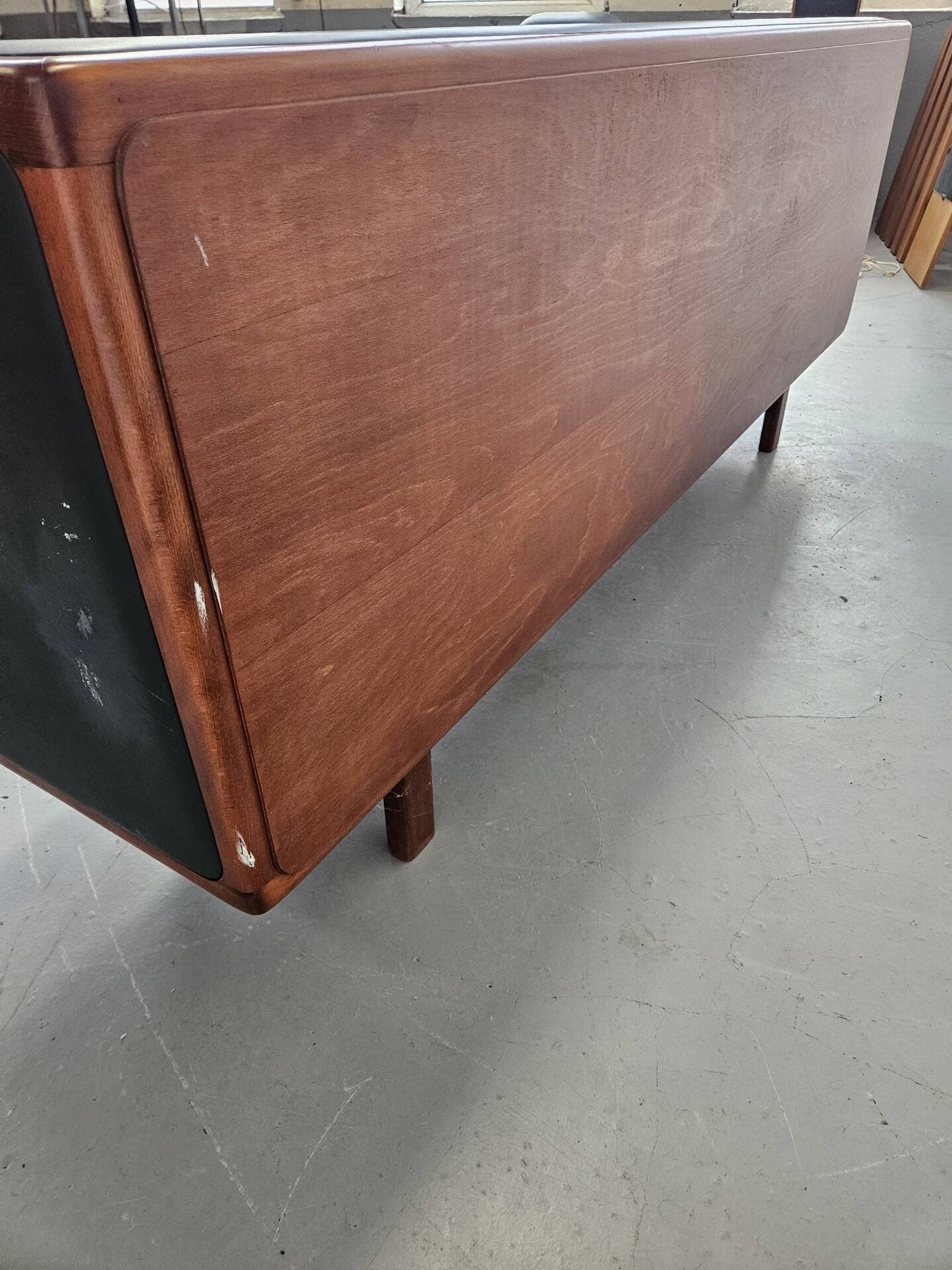 Vintage enfilade in teak and leather, 1970s.