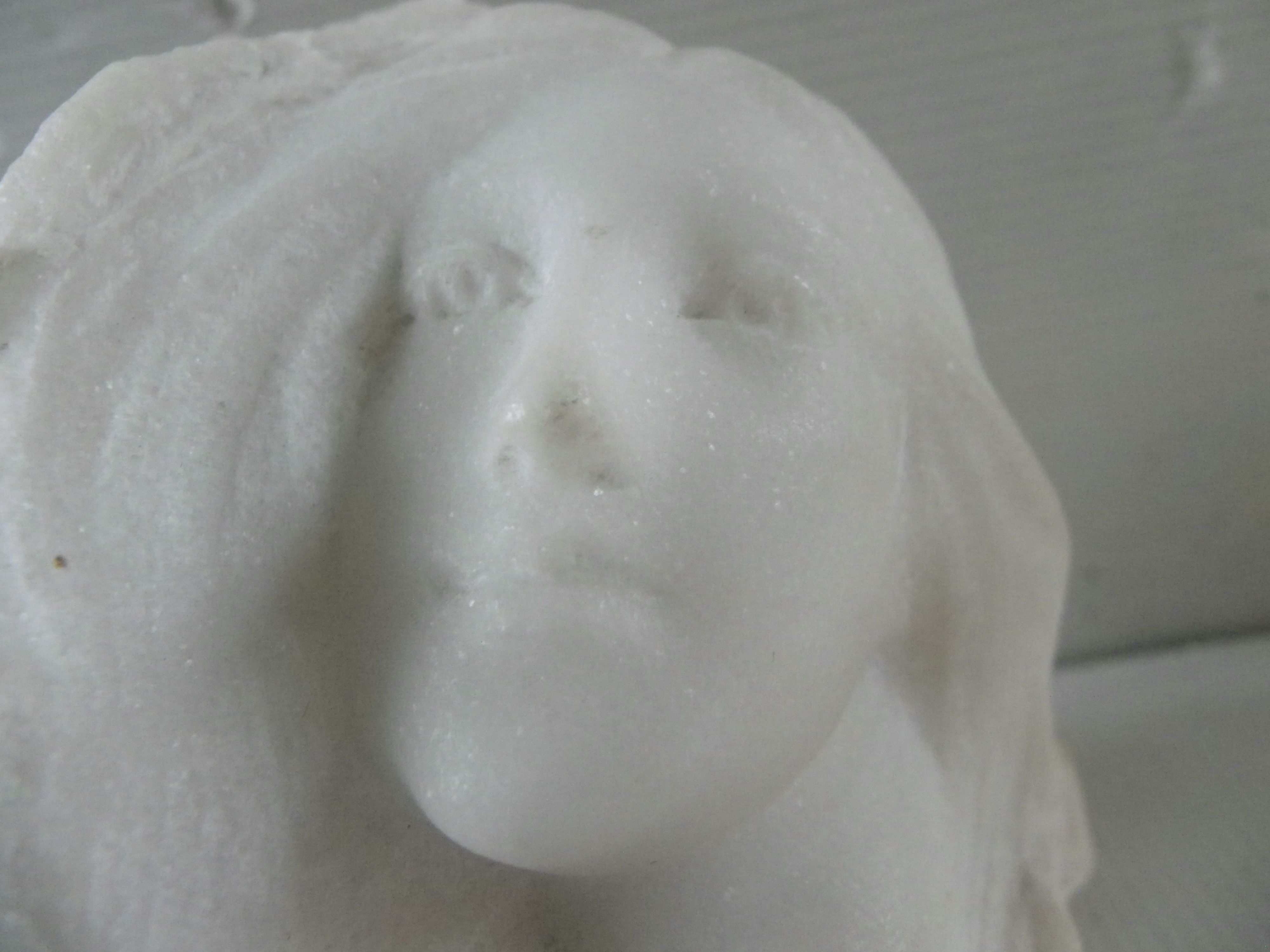 Sculpture face of woman in marble block 13 x 12 x 8 cm