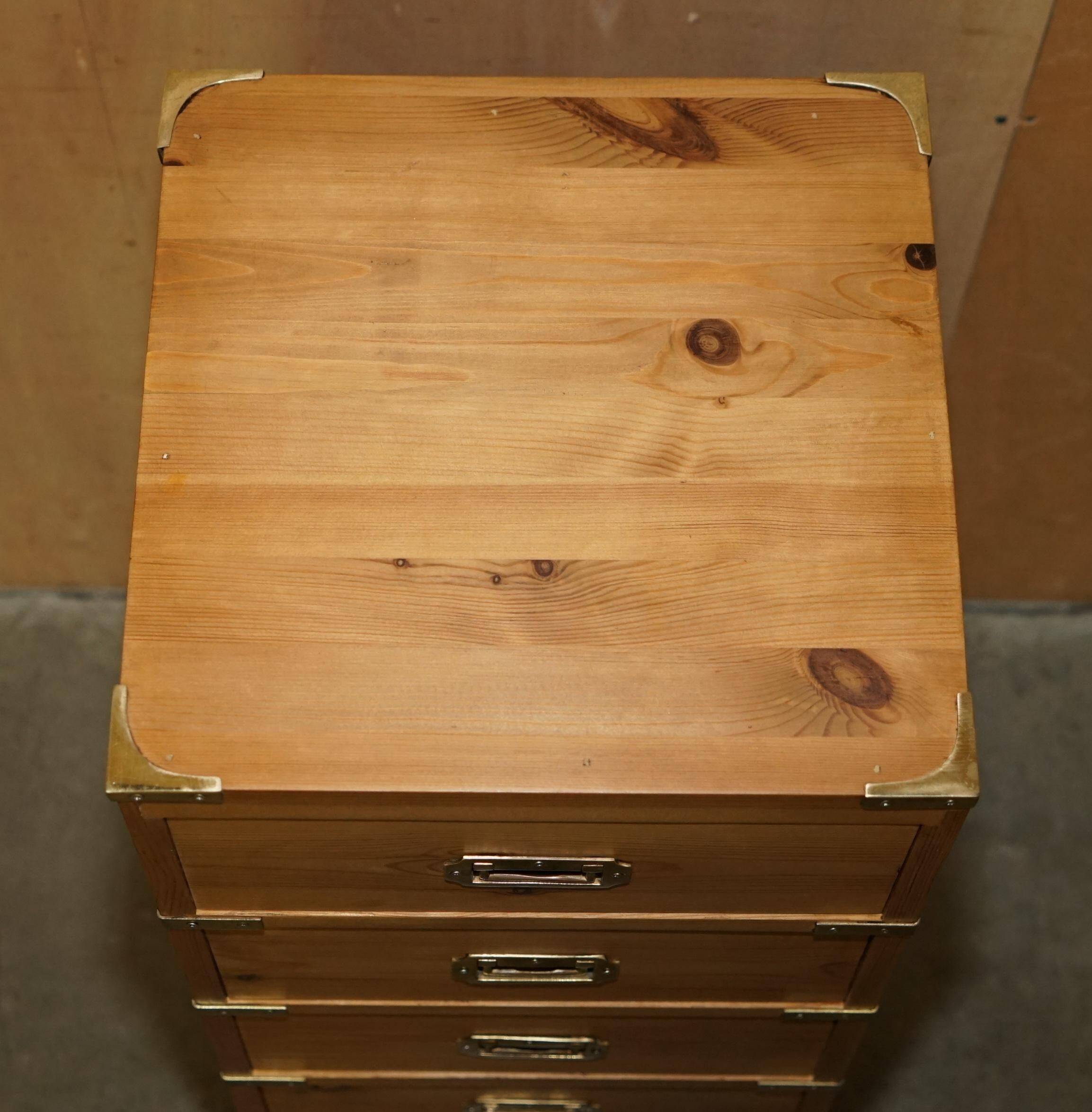 Restored vintage military high chest of drawers in English pine and brass.