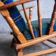 Set of 2 oak armchairs in mid-century style, covered in a blue-green checked fabric.
