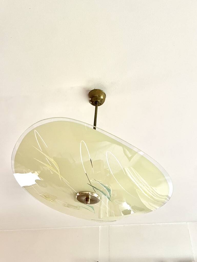 Pale yellow asymmetrical suspension cup 1960