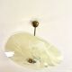 Pale yellow asymmetrical suspension cup 1960