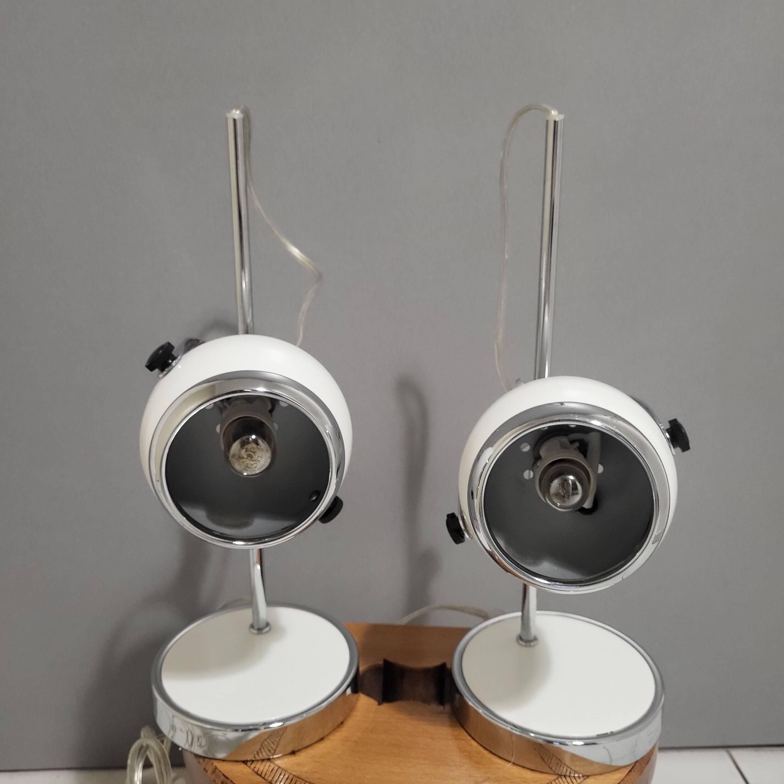 White and chrome metal eye ball lamps