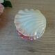 Vintage shell-shaped catchall in iridescent cream and pink ceramic.