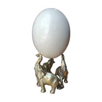 Ostrich egg on bronze elephant plinth
