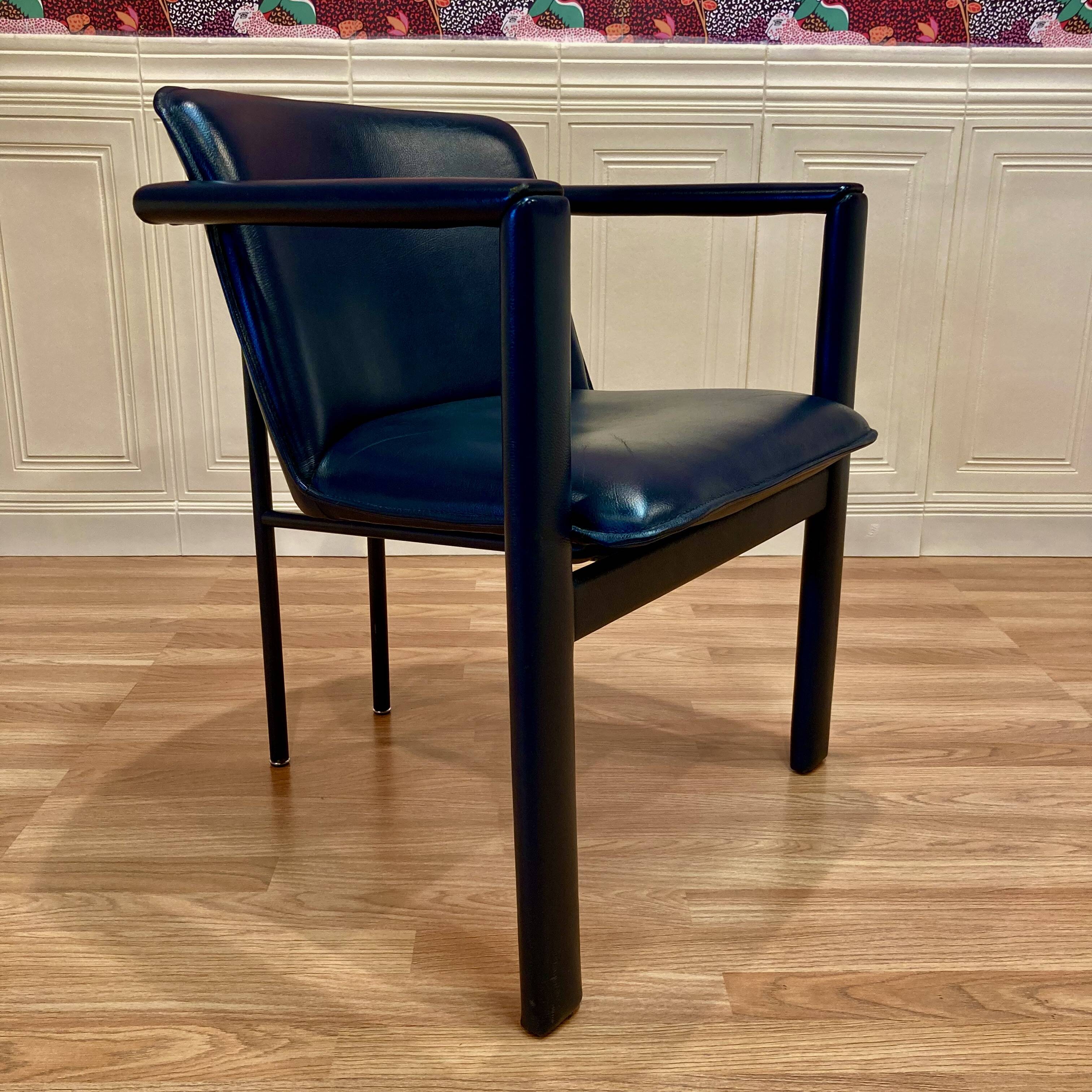 Set of 3 designer leather and metal armchairs.