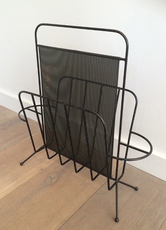 Black lacquered metal and perforated metal magazine rack designed by Mathieu Matégot 50.