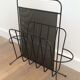 Black lacquered metal and perforated metal magazine rack designed by Mathieu Matégot 50.