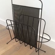 Black lacquered metal and perforated metal magazine rack designed by Mathieu Matégot 50.