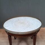 Tablr low dessu marble called "hot water bottle"