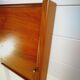 Mid century 1970s retro teak headboard with two hinged bedsides, upholstered in black by 'slumberlan