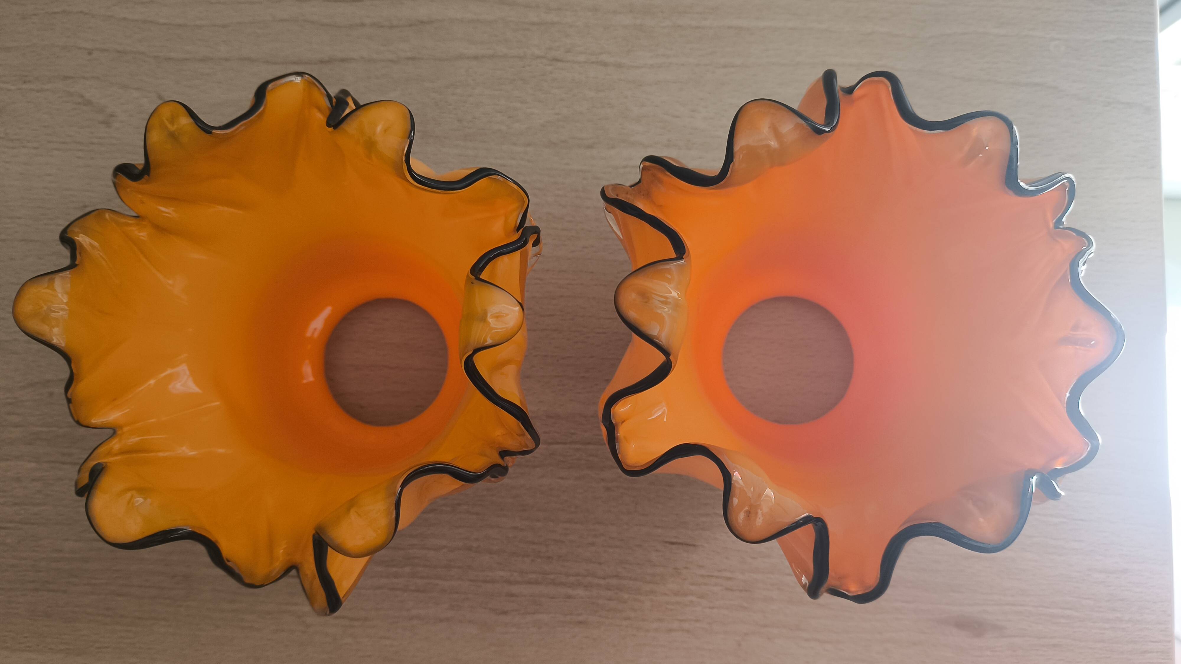 Pair of orange glass tulips with black trim, vintage 70s.
