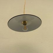 Old industrial black and white vintage enameled sheet metal pendant light