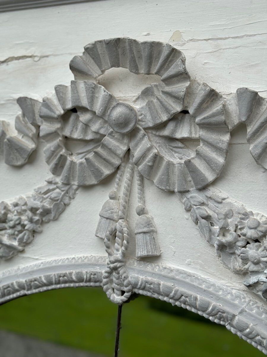 Louis XVI style fireplace mirror, carved wood trumeau with white and grey highlights, 18th century