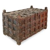 Large wooden and metal chest with red patina