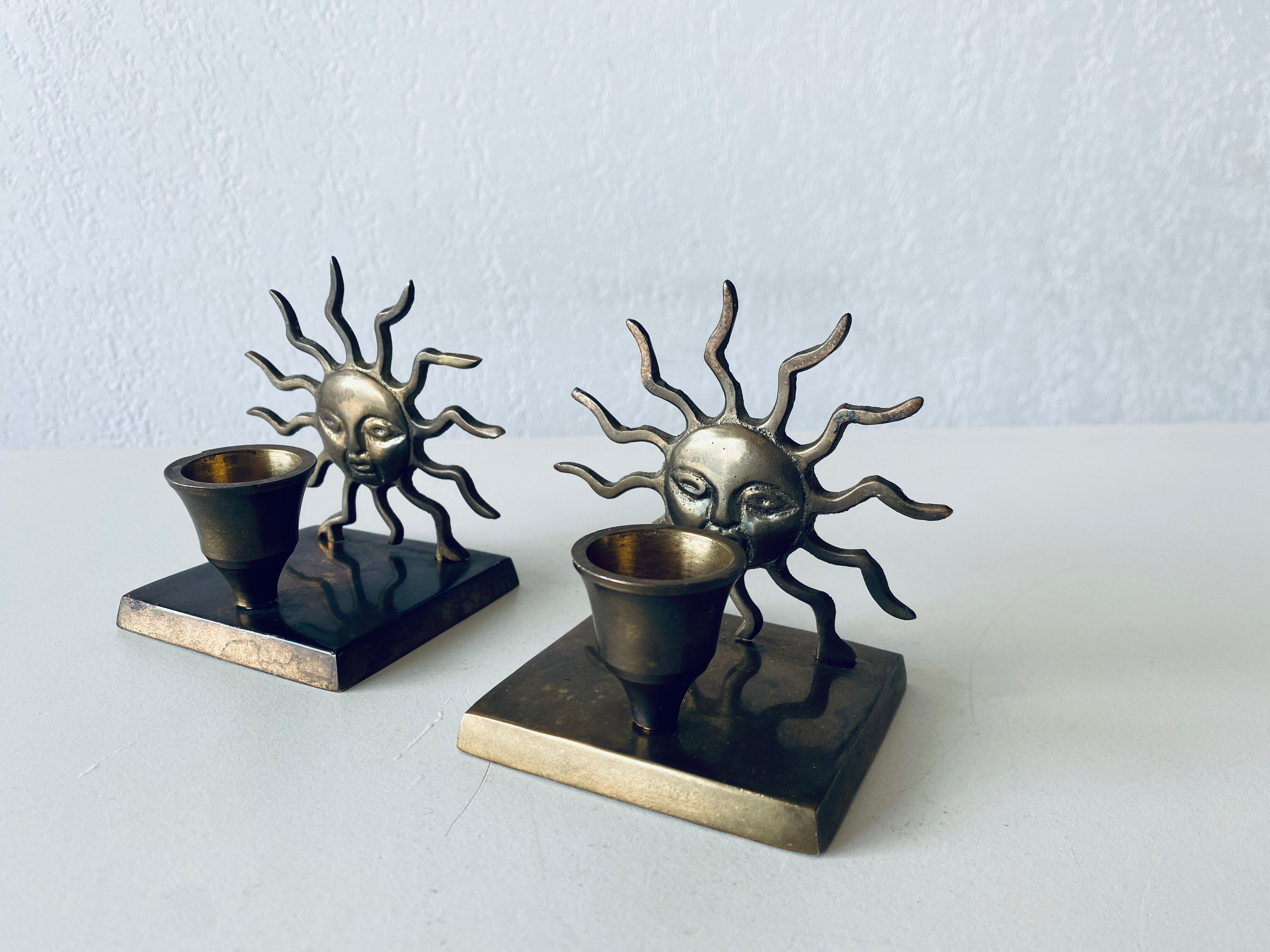 Pair of sun candle holders