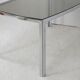 Living table. chrome metal, curved smoked glass slab, france, circa 1970.