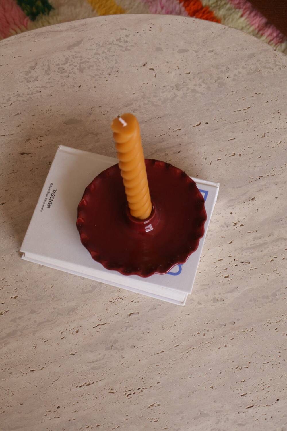Burgundy ceramic candle holder with serrated plate