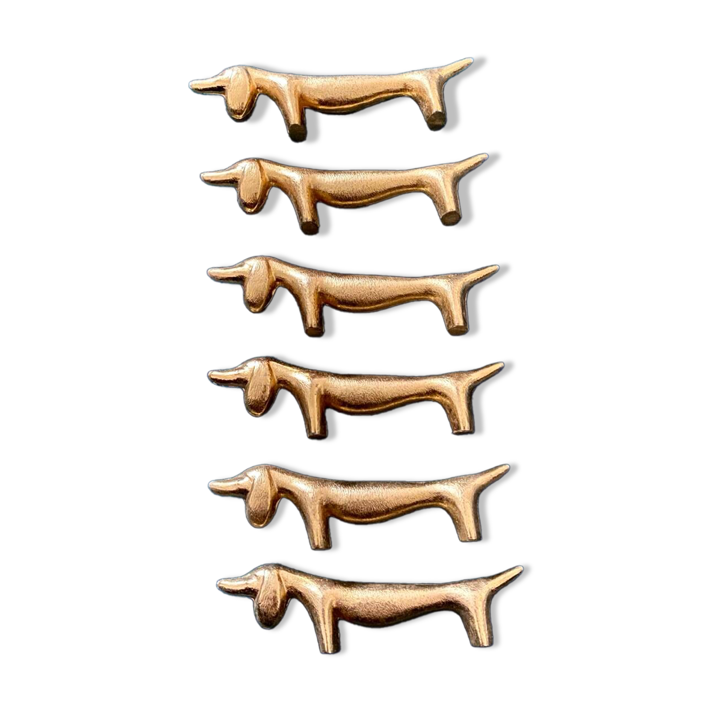 6 dog-shaped knife holders in fine gold-plated metal