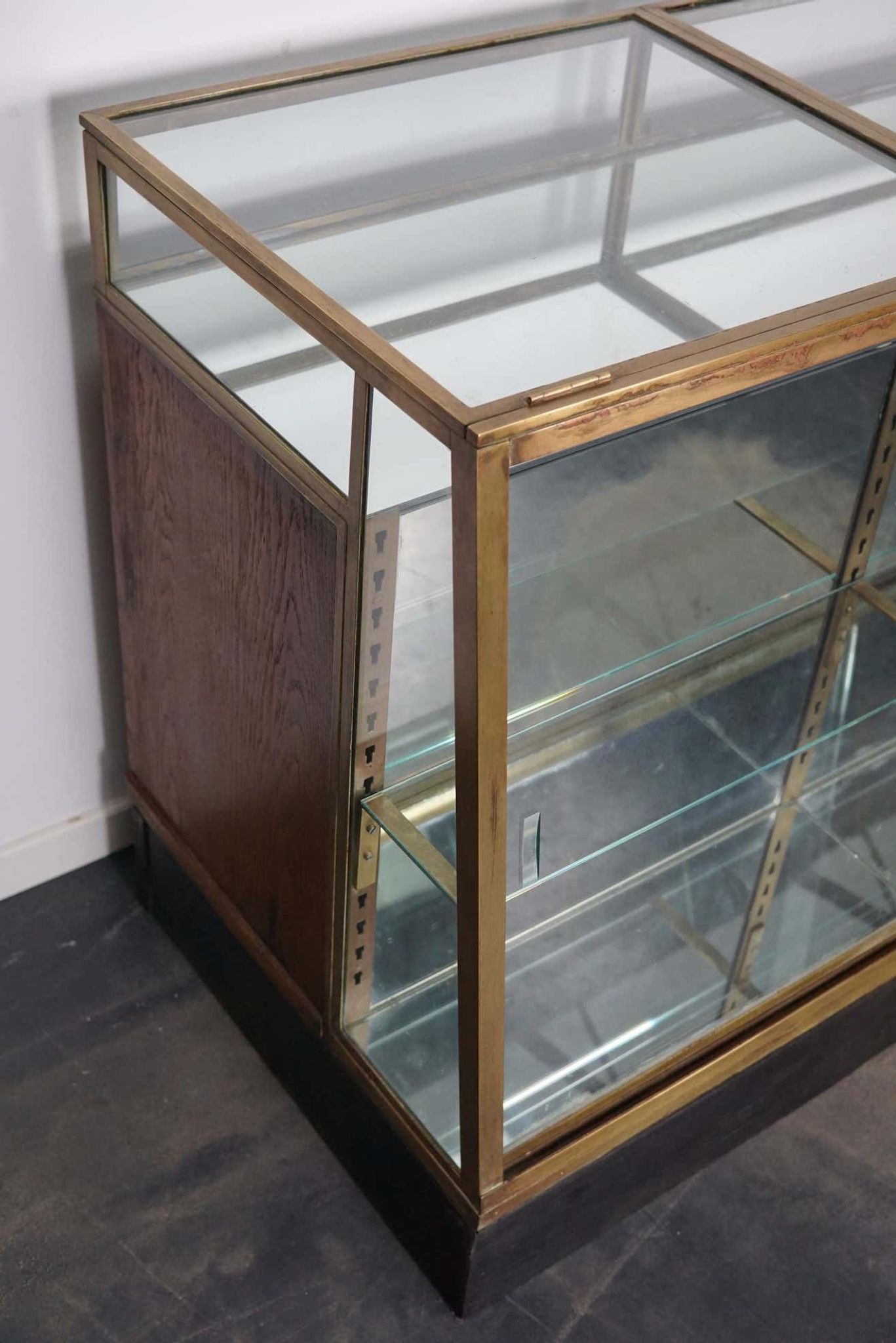 Counter or shop window in oak glass and brass France around 1920