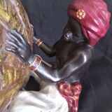 Centerpiece (empty pocket) in resin with African character