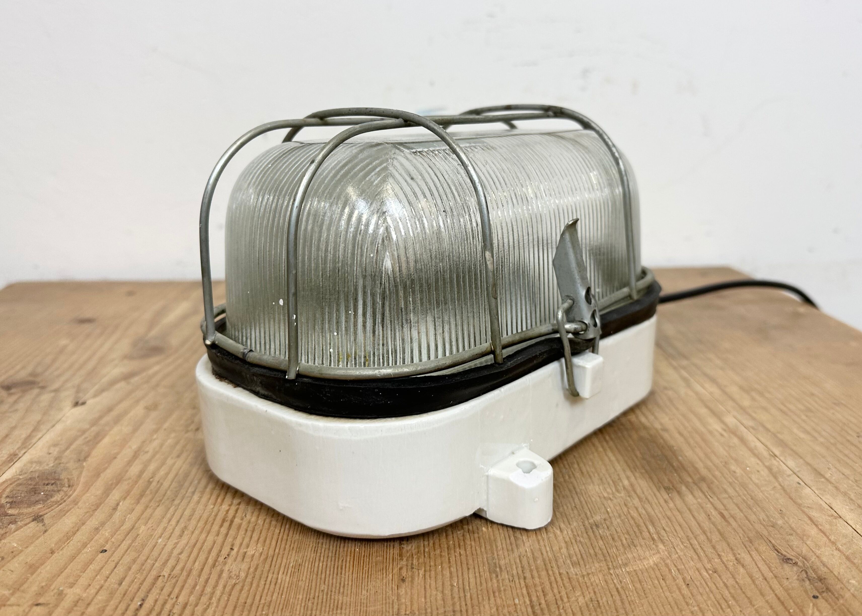 Industrial white porcelain cage wall light with ribbed glass, 1970s